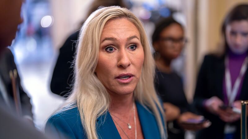 Rep. Marjorie Taylor Greene, R-Ga., talks to reporters after meeting privately with House...