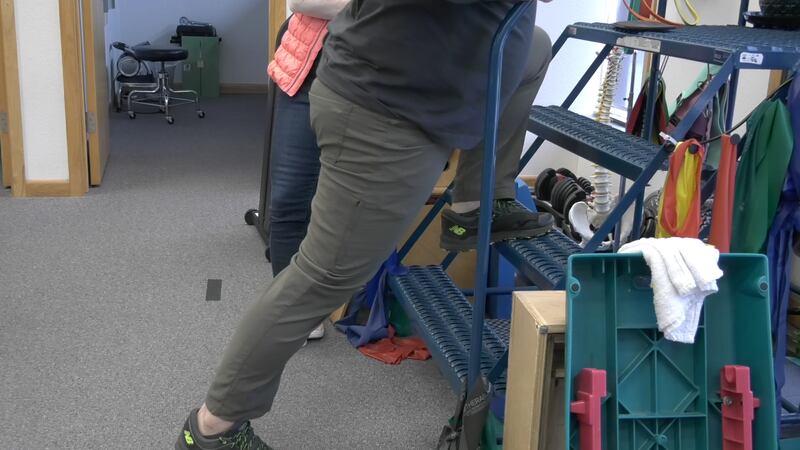 A man receives physical therapy in Fairbanks during a community clinic.