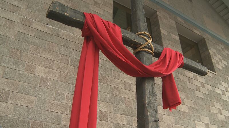 A large cross is raised at the Alaska Center for the Performing Arts in Anchorage, Alaska on...