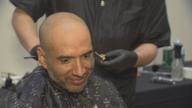 Lorenzo Lozano gets a free haircut at Anchorage Project Homeless Connect
