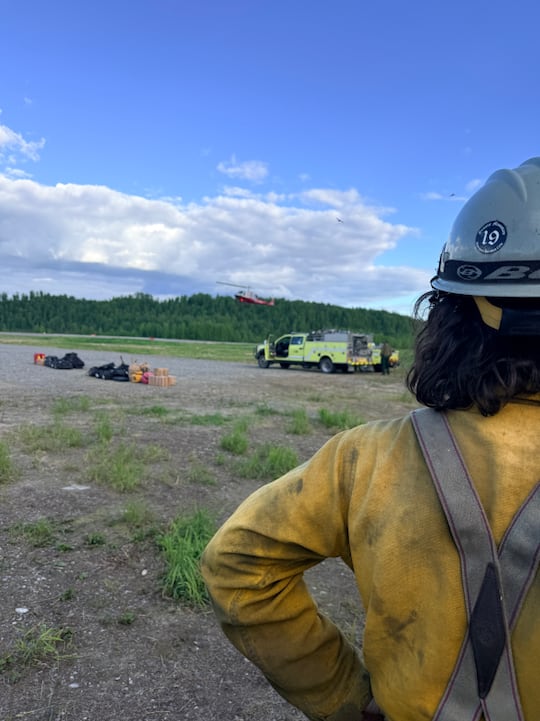 A helitack crew defended a cabin and heavy equipment as the fire passed through a remote area...