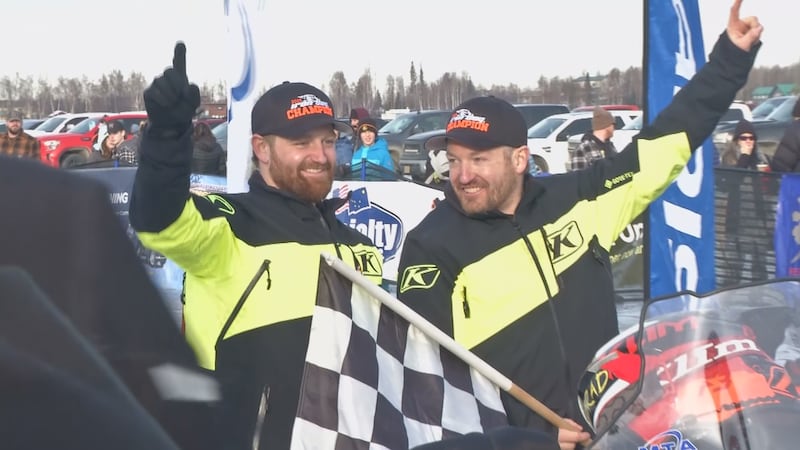 Champions Team 20 (left; Bradley George, right; Robby Schachle) celebrate after winning the...