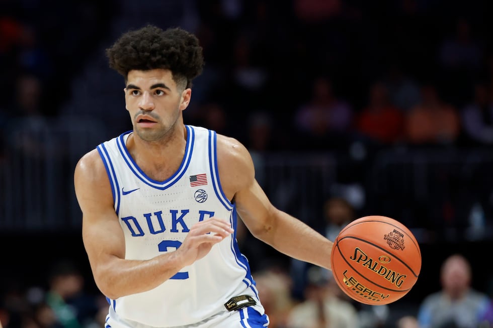 Duke guard Cayden Boozer brings the ball upcourt against Virginia during the first half of an...