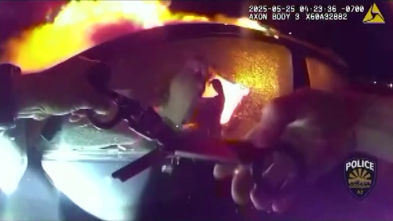 A Goodyear officer heroically rescued a woman trapped in a burning car after a freeway crash...