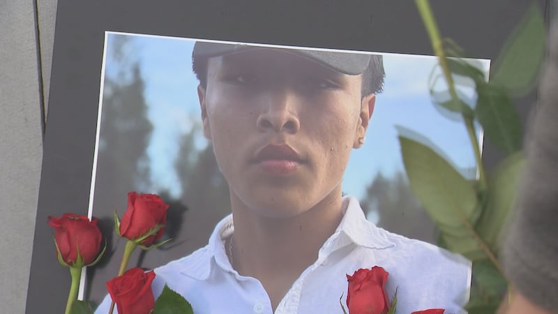 Roses are laid at a memorial for Aaron Jon Edwards Jr.