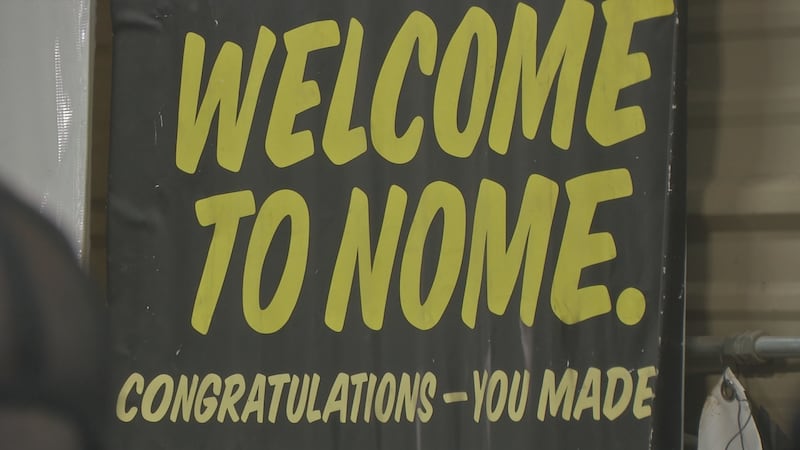 A sign welcomes Iron Dog racers to Nome inside the Public Works shop.