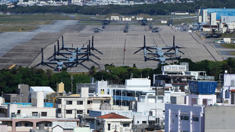 FILE - U.S. MV-22 Osprey transport aircraft are parked at the U.S. Marine Corps Air Station...