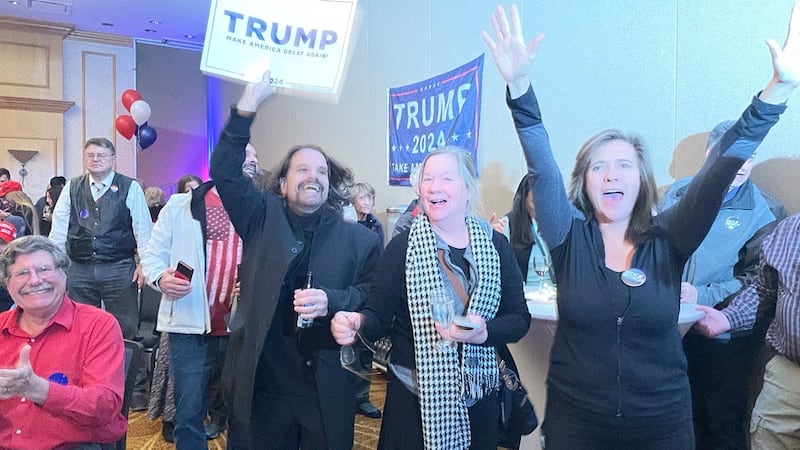 Supporters of Nick Begich cheer while watching early results of the 2024 presidential election...