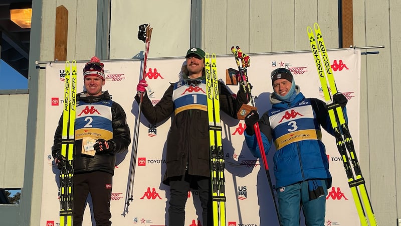 Luke Jager (bib #3) stands with Walker Hall (bib #2) and John Steel Hagenbuch (#1) on the...