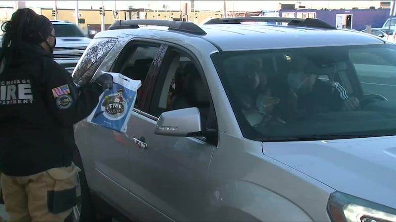 Mia Carson hands out fire safety packets