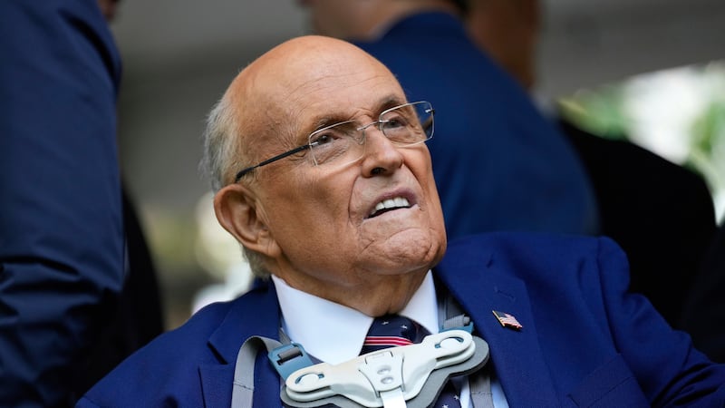FILE - Former NYC mayor Rudy Giuliani participates in a ceremony commemorating the anniversary...