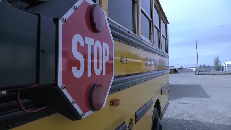 Stop sign on a bus operated by Durham School Services.