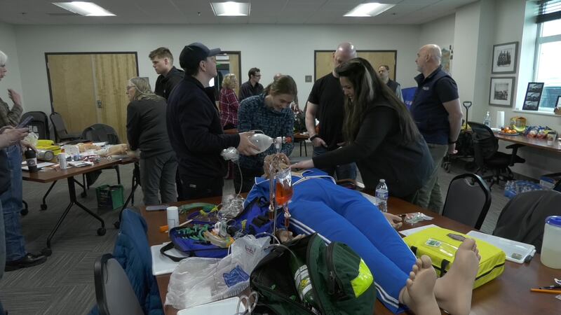 LifeMed instructors helping students learn airway management