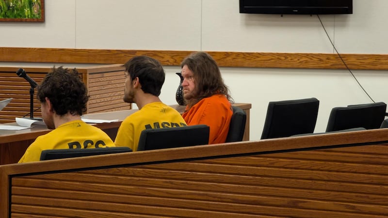 Sean Mobley, far right in orange, appears in court in Palmer for an arraignment on Tuesday,...