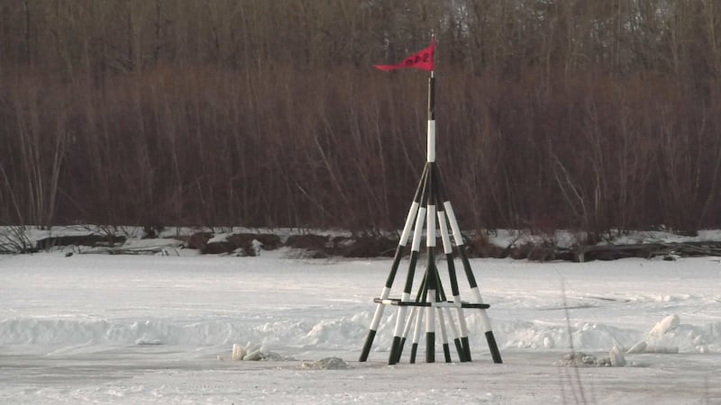 Each year, a “tripod” (actually a quadrupod) is placed on the ice in the Tanana River,...