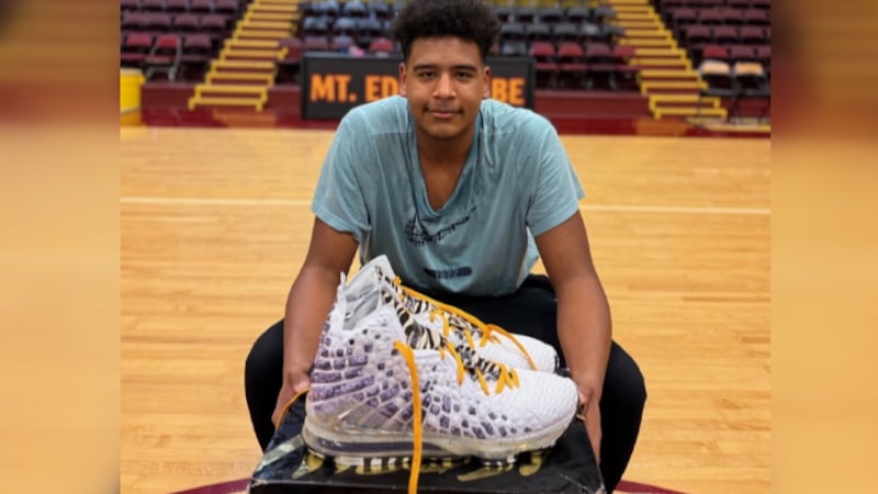 15-year-old Rashawn Stone holds his Nikes, which were originally made for LeBron James.