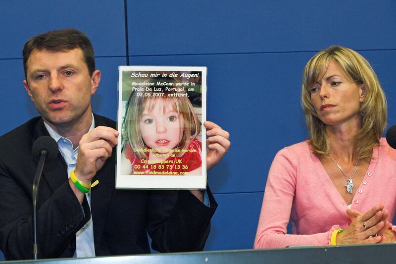 FILE - Gerry, left, and Kate McCann, parents of four-year old Madeleine McCann, present a...