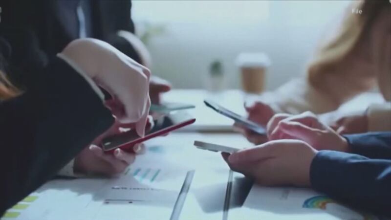 File photo of kids with cell phones