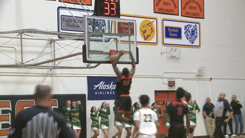 Hoover's DeWayne Brown throws down a two-handed slam on day one of the Alaska Airlines Classic...