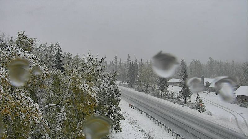 This image from an Alaska 511 weather camera shows snow accumulating near Summit Lake Lodge on...