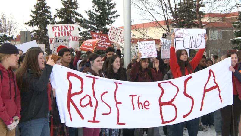 West Anchorage High School students took part in a walkout Friday in support of increasing...
