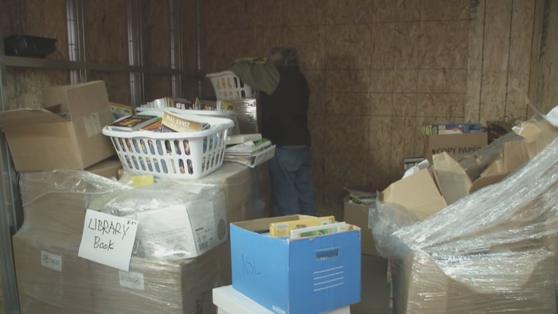 Alys Culhane sorts through some of the books that were delivered to her on Monday, March 10