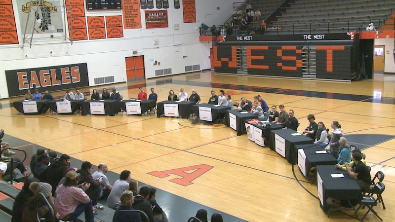In a celebration of years of hard work, 11 West Anchorage High School student-athletes playing...