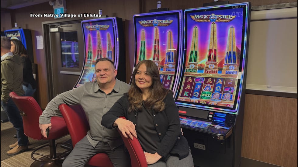 Dan and Robin Amadon, the first Chin’an Gaming Hall patrons, sit in front of gaming machines...