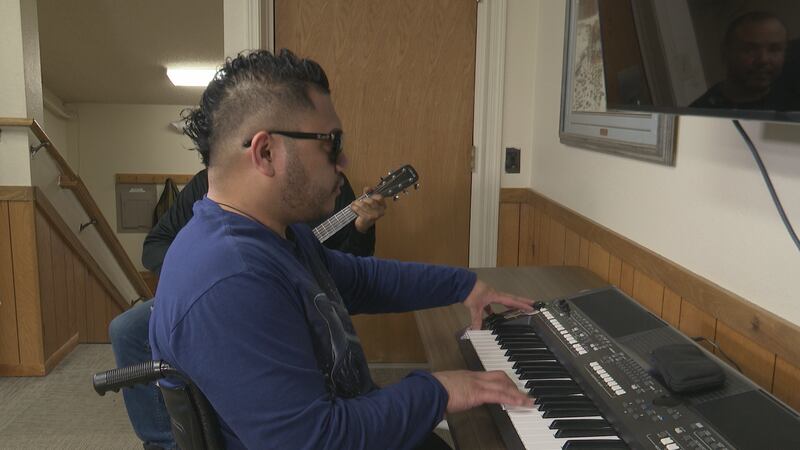Shaquil "Shaq" Aribuk plays the piano at the Alaska Center for the Blind an Vision Impaired