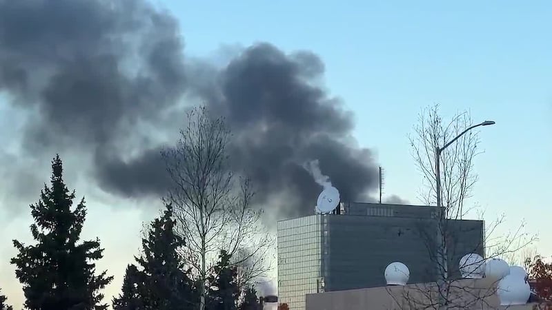 Black smoke could be seen in the skies above Anchorage Thursday morning as a large fire...