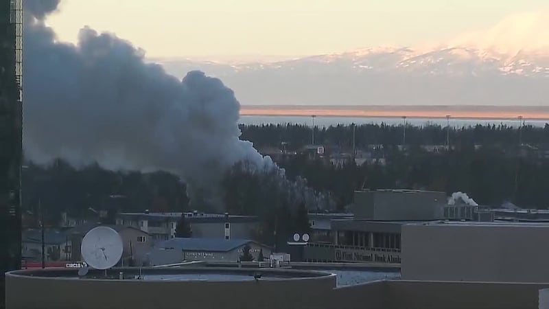 Black smoke could be seen in the skies above Anchorage Thursday morning as a large fire...